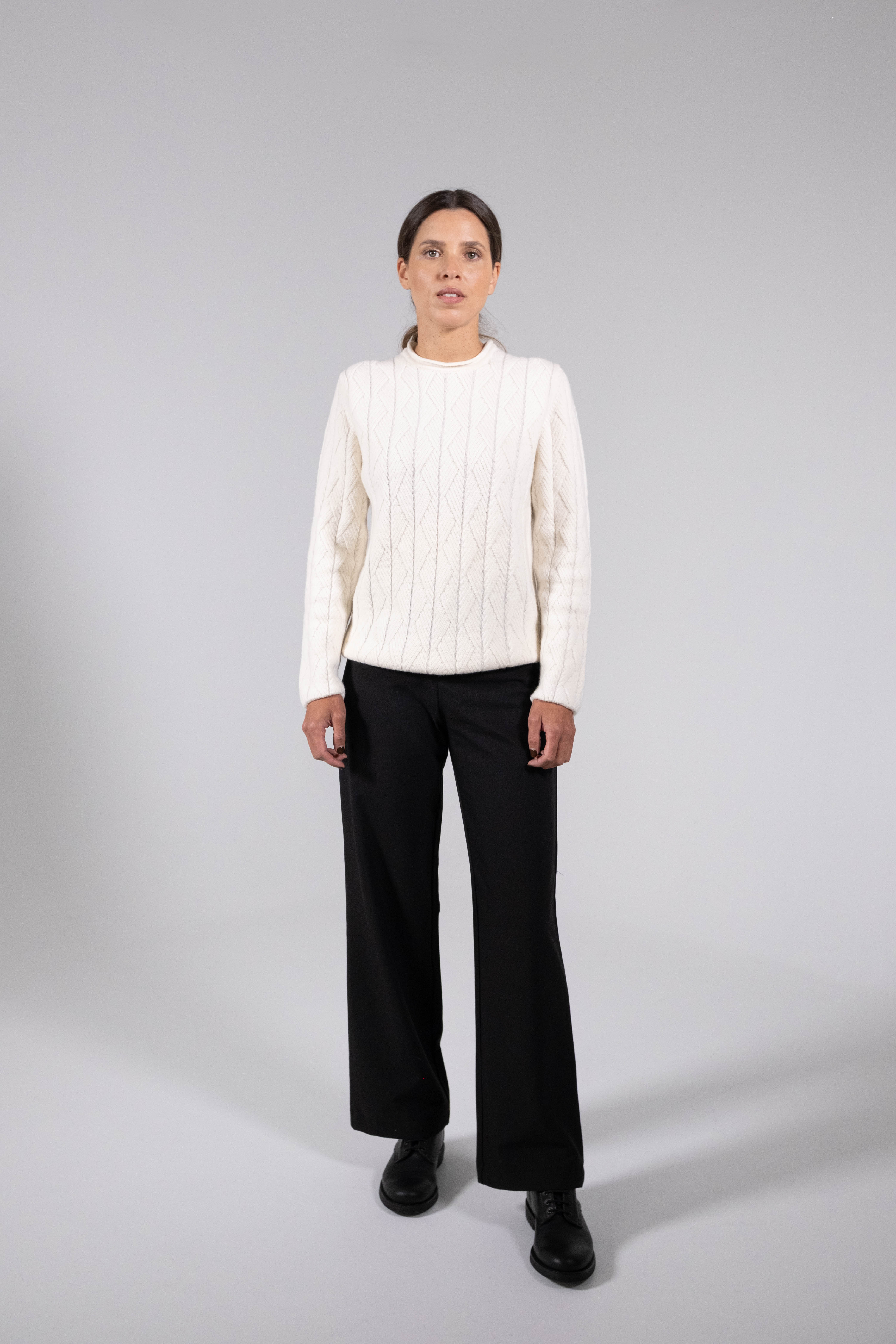 Wool sweater with geometric texture.